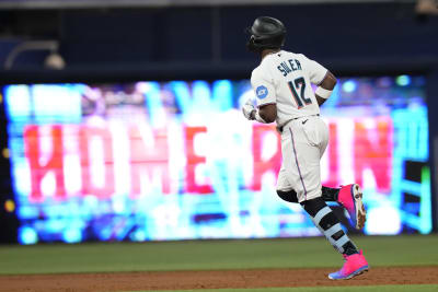 Miami Marlins Luis Arraez (3) with first base coach Jon Jay (11