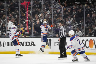 Oilers jersey toss top