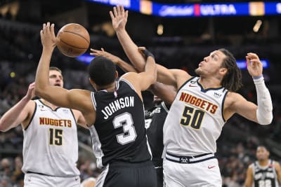 The shoes of Denver Nuggets' Jamal Murray are shown during the first  quarter of an NBA basketball game against the Toronto Raptors, Friday, Aug.  14, 2020, in Lake Buena Vista, Fla. (Mike