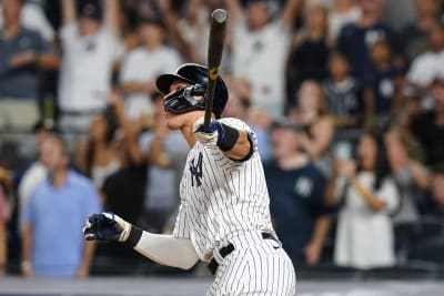 New York Yankees Aaron Judge walks off the field after batting