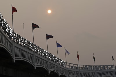 Manhattan is seen from Yankee Stadium through a haze of smoke before a  baseball game between the Philadelphia Phillies and the New York Yankees,  Wednesday, July 21, 2021, in New York. Wildfires