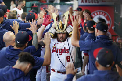 Los Angeles Angels' Mike Moustakas celebrates after hitting a