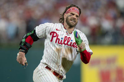 Philadelphia Phillies - Photo of Nick Castellanos wearing the powder blue Phillies  jersey in the dugout.