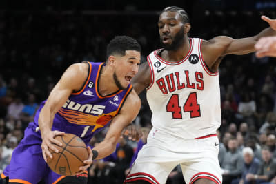 Devin Booker scores 23 in return, Suns roll past Heat to clinch playoff  spot