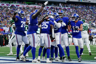 New York, USA. August 8, 2019, East Rutherford, New Jersey, USA: New York  Giants quarterback Daniel Jones (8) celebrates with running back Saquon  Barkley (26) after throwing his first touchdown pass during