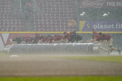 Greene retires 20 straight in rain-shortened win for Reds