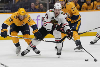 Chicago Blackhawks center Kirby Dach, right, celebrates his tying