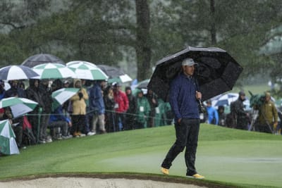 The Masters: Third round suspended as rain drenches field at