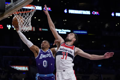 Los Angeles Lakers guard Russell Westbrook (0) shoots against the  Washington Wizards during the first half