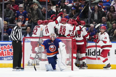 Canes' Aho, Oilers' Hyman each take a puck off the face