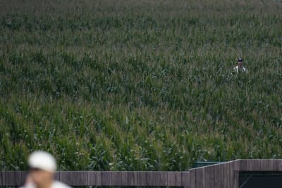 Kevin Costner leads the Yankees and White Sox out of the cornfield