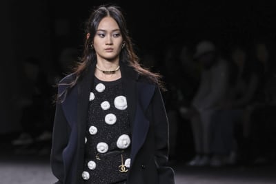 Chanel takes glittering, camellia-themed line-up to Paris catwalk