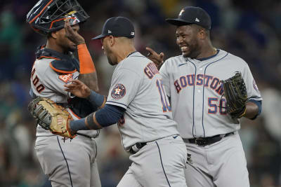 Seattle Mariners' Mitch Haniger, right, is greeted by Ty France