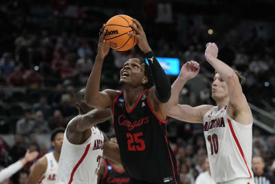 Houston center Josh Carlton (25) works to the basket as Oklahoma