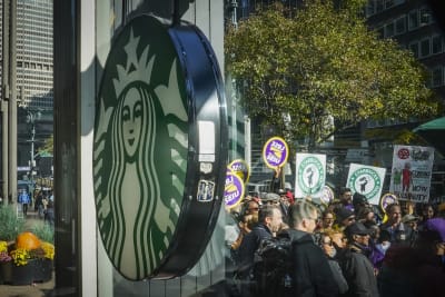 Thousands of Starbucks workers go on a one-day strike on one of the chain's  busiest days of year