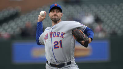 New York Mets starting pitcher Max Scherzer tosses the ball up