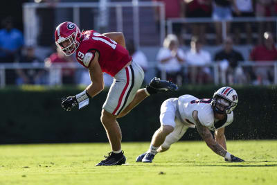 Beck throws and runs for TDs to launch new era as No. 1 Georgia