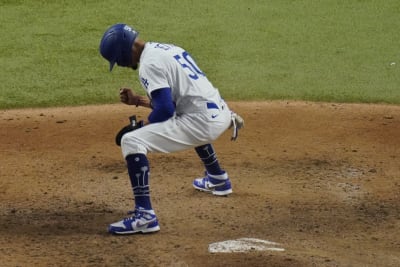 Los Angeles Dodgers' Mookie Betts scores on a fielders choice by Max Muncy  during the fifth inning in Game 1 of the baseball World Series against the  Tampa Bay Rays Tuesday, Oct.