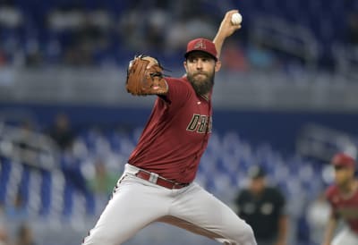 Bumgarner wins pitching duel as D-backs edge Rangers 3-2 - The San Diego  Union-Tribune