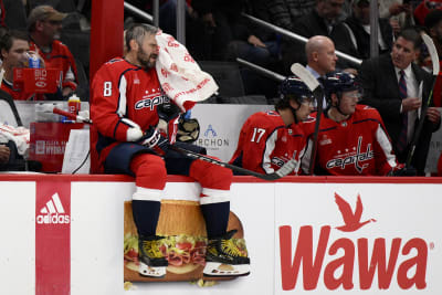 Bruins top NHL season points mark, beating Capitals 5-2