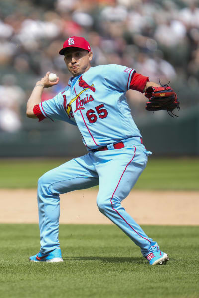 Cardinals reliever Gallegos gets wiped down by umpire after using rosin bag  on his left arm