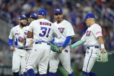 Toronto Blue Jays catcher Jose Molina (8) is congratulated by