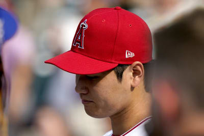 American League's Shohei Ohtani, of the Los Angeles Angels, smiles with  National League's Freddie Freeman, of the Los Angeles Dodgers, left, during  the MLB All-Star baseball game against the National League in