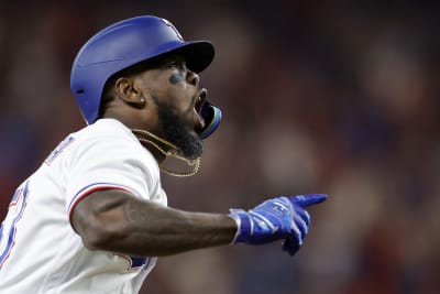 Adolis Garcia of the Texas Rangers celebrates after hitting a solo News  Photo - Getty Images