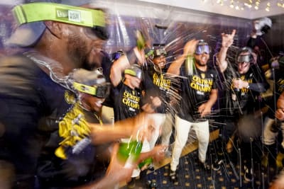 Milwaukee Brewers' owner Mark Attanasio and wife Debbie celebrate with  broadcaster Bob Uecker after clinching the National League Central Division  after a baseball game against the St. Louis Cardinals Tuesday, Sept. 26