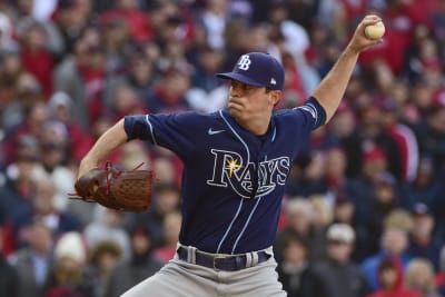 Fans throw debris onto field, at Guardians players following