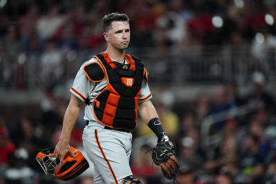 San Francisco Giants' Logan Webb wears a hat and shirt for first baseman Brandon  Belt before a baseball game between the Giants and the Arizona Diamondbacks  in San Francisco, Wednesday, Sept. 29