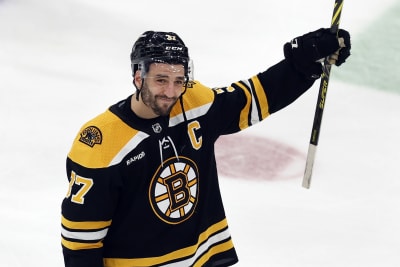 Bruins captaincy passes from Bergeron to Marchand