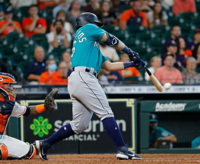 Seattle Mariners' Ty France (23) and Kyle Seager celebrate after a baseball  game against the Houston