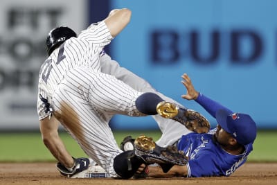 New York Yankees pitcher Sal Romano gives the ball to manager Aaron Boone  against the Toronto Blue Jays during the seventh inning of a baseball game  on Thursday, Sept. 9, 2021, in