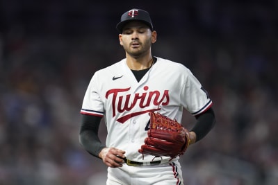 Minnesota Twins' Alex Kirilloff walks to the dugout after being