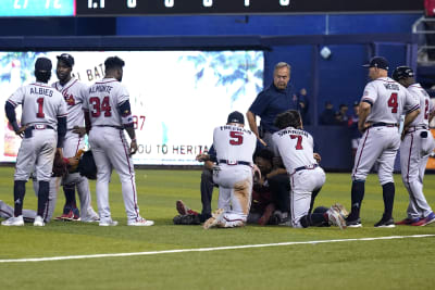 Atlanta Braves left fielder Ronald Acuna Jr. (13) and Braves mascots Blooper  have fun in the dugout before am baseball game against the Miami Marlins  Tuesday, July 31, 2018 in Atlanta. (AP