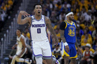 Fox leads Kings past Warriors 126-123 in playoff return