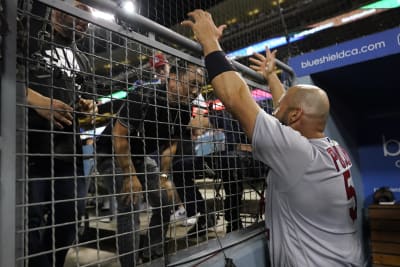 Pujols concludes return to St. Louis with 2 hits, Molina jersey