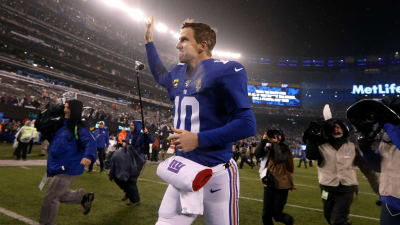 New York Giants quarterback Eli Manning looks disappointed while talking to  the coaches up stairs. The Philadelphia Eagles defeated the New York Giants  27 to 6 at Giants Stadium in East Rutherford