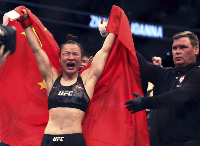 Zhang Weili Israel Adesanya keep title belts at UFC 248