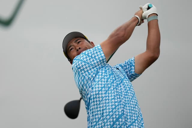 Hisatsune chips in for birdie after water ball, shoots 63 to take