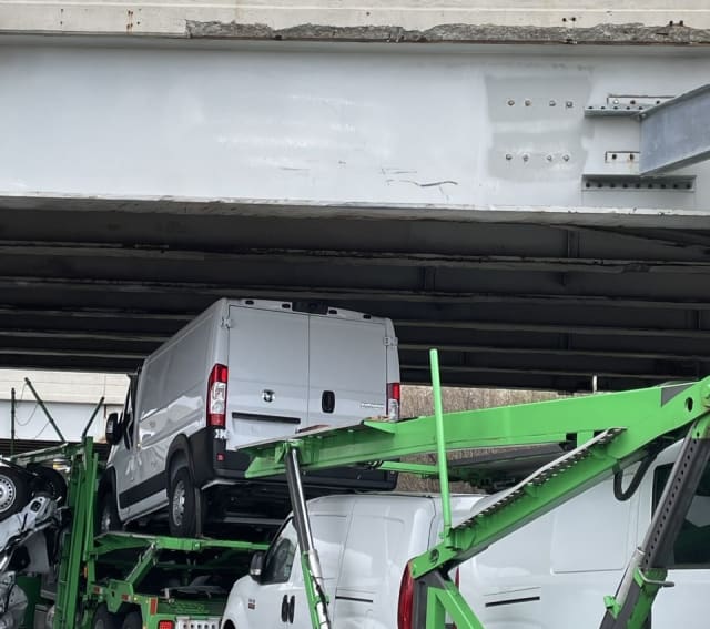 Car hauler loaded with work vans crashes into Telegraph Road
