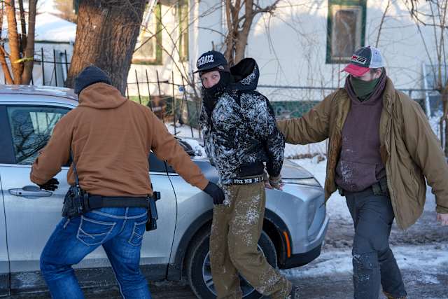 Immigration agents draw guns and arrest activists following them