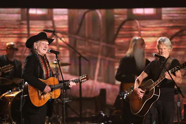 Willie Nelson keeps living the life he loves at 92. 'I'm not through with  it yet'