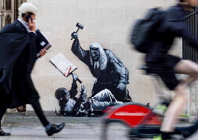 Banksy mural of a judge beating a protester is scrubbed from