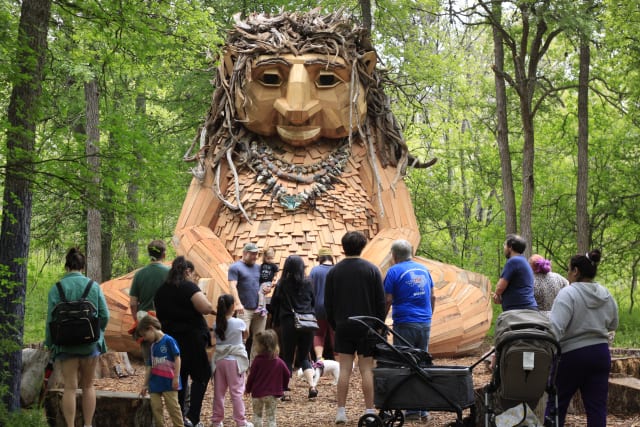 Visit Malin, a giant wooden troll, at a park in Austin
