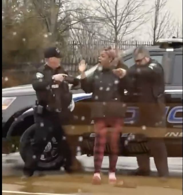 Officer who hit woman in McDonald's dispute placed on leave