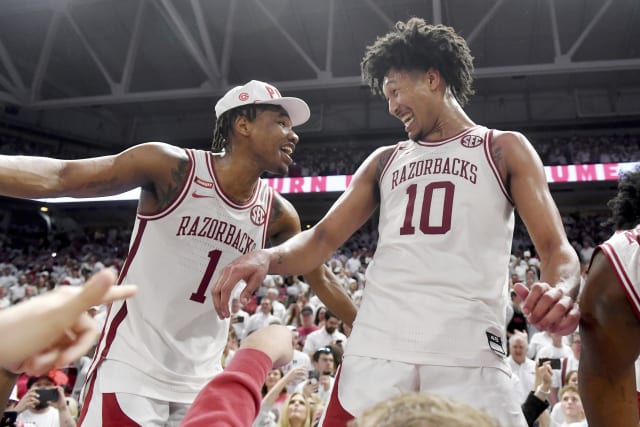 Hog wild! Unranked Arkansas upsets No. 1 Auburn 80-76 in OT