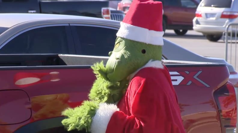 The departments coordinated a sketch of the infamous Grinch attempting to steal items from a parked vehicle.