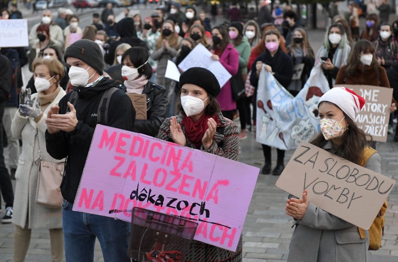 In this picture taken on Oct. 20. 2021 in Kosice Slovakia, people protest against proposed bill that tightens access to abortion. The banner left says 